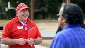 Rich Bonanno talking with a person whose back is to the camera