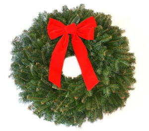 A pine wreath with a red velvet bow placed in the middle top.